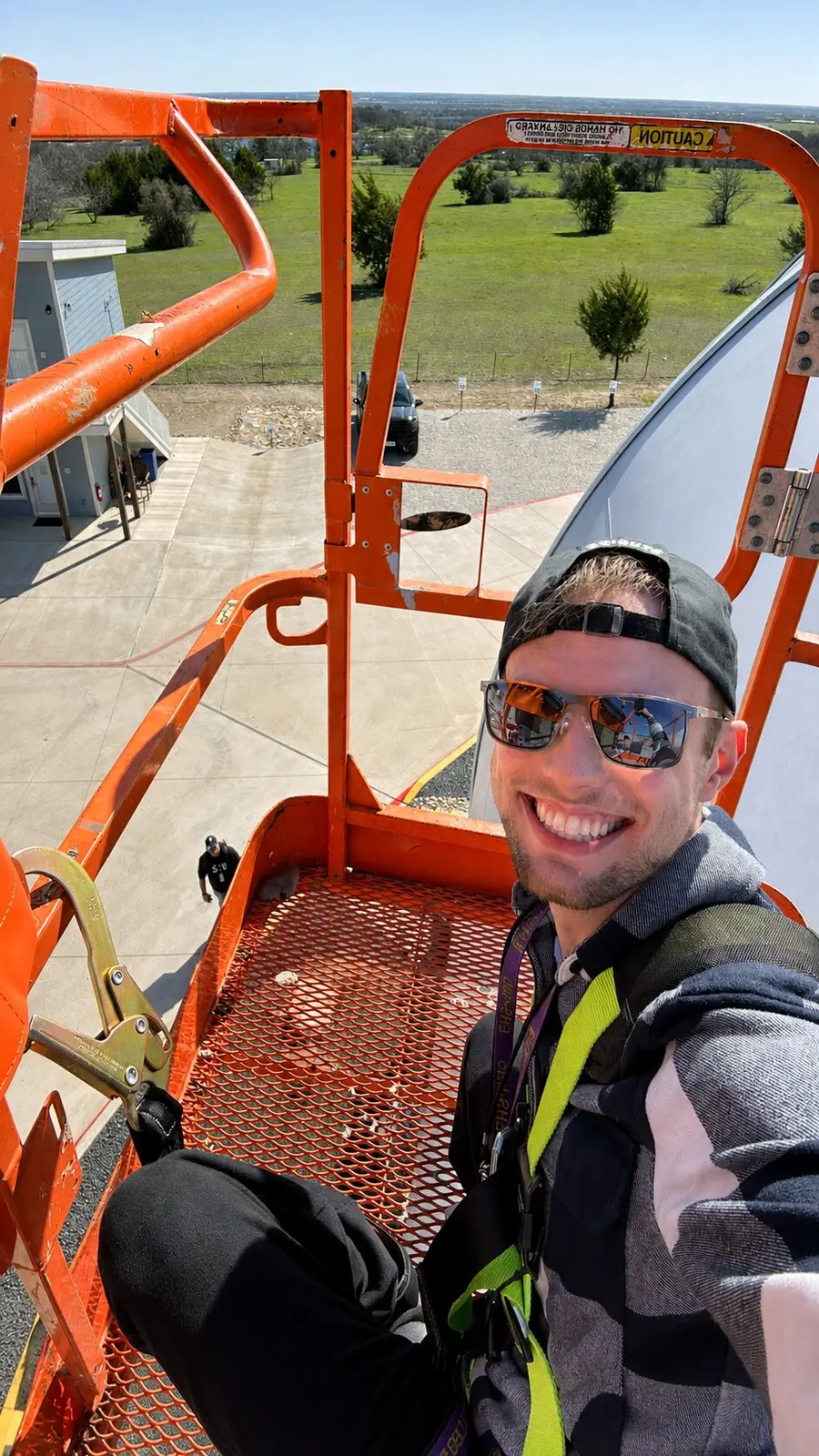 Jack working from a lift during a wireless installation