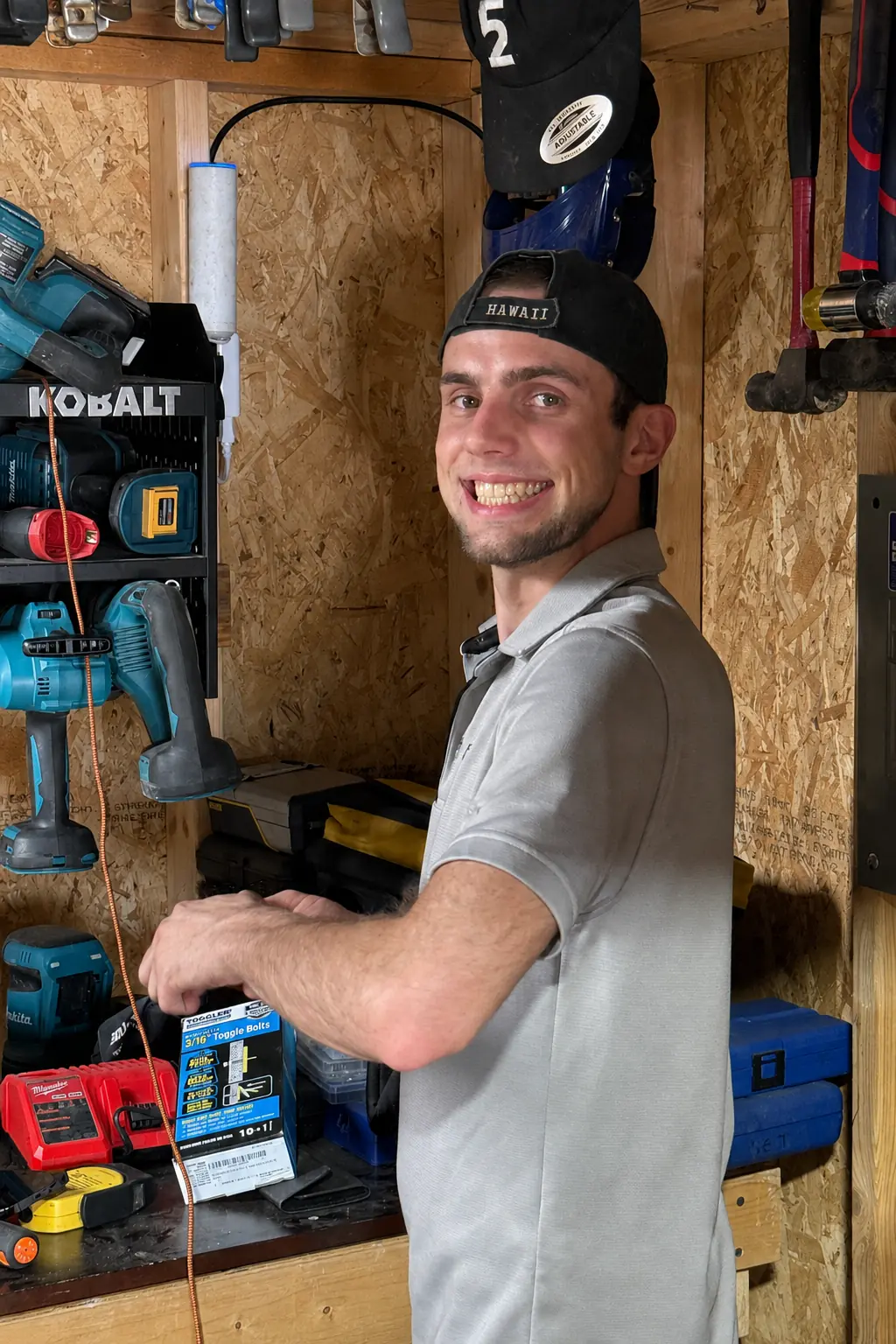 Jack preparing tools and mounting hardware for a network installation